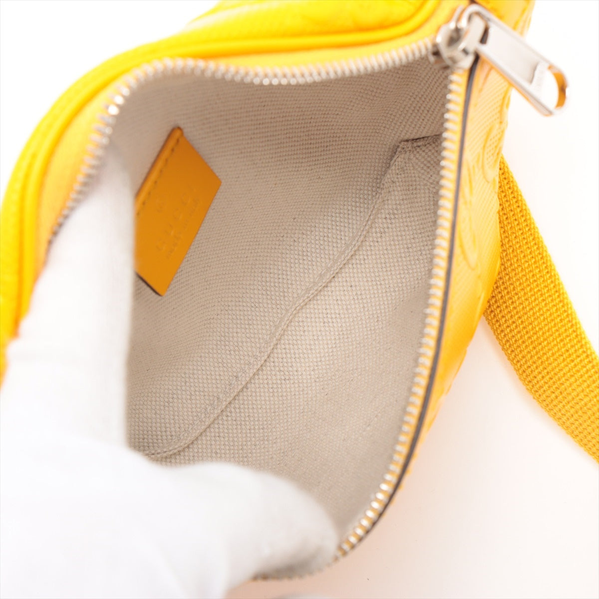 Gucci GG embossed Leather Sling backpack Yellow 658582