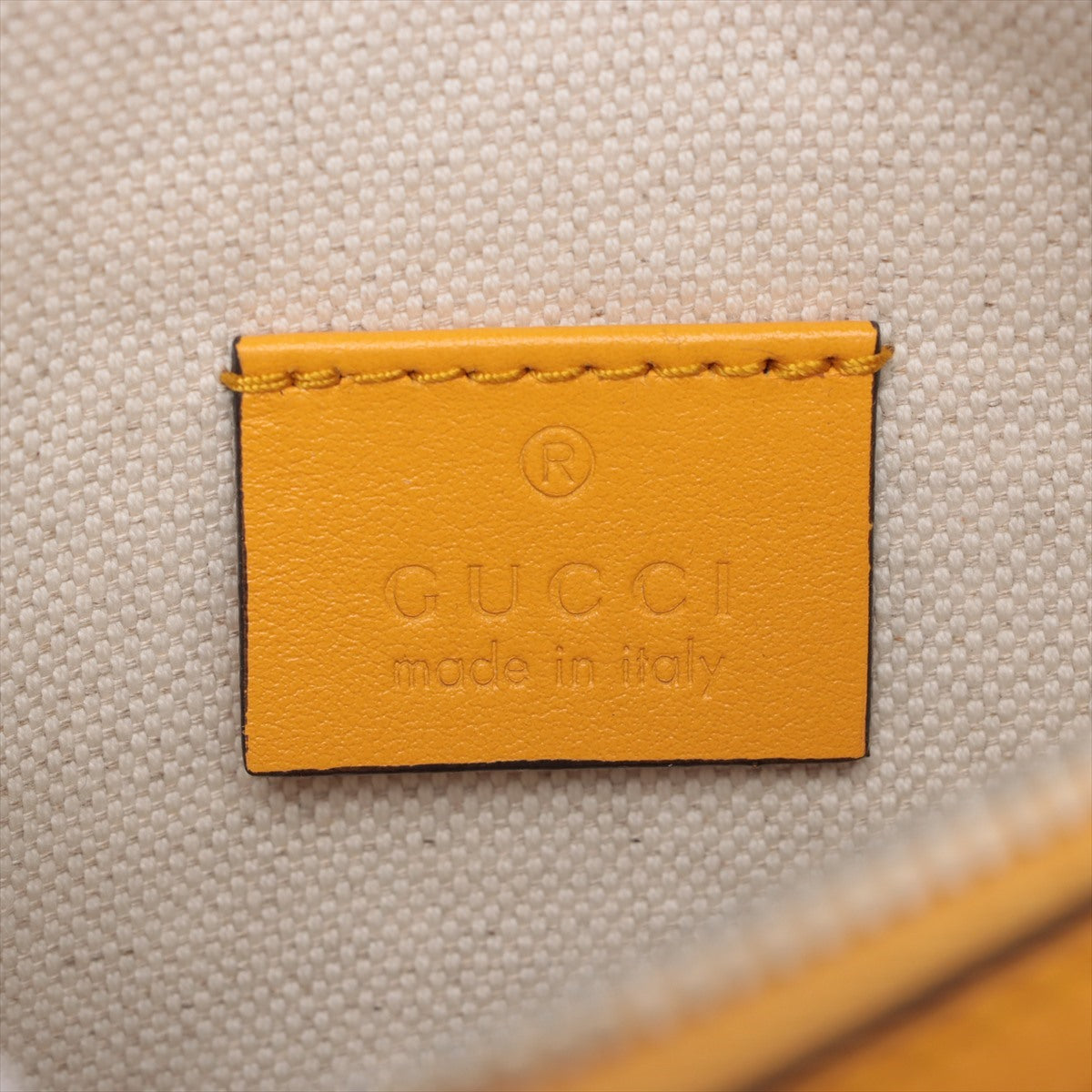 Gucci GG embossed Leather Sling backpack Yellow 658582